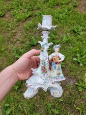 Antico candelabro statuina