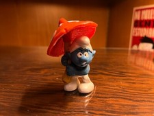 Puffo con fungo ombrello