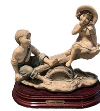 Figurina romantica d'epoca "Sulla motosega" di Giuseppe Armani, Italia, 1995