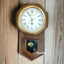 Antico orologio a pendolo da