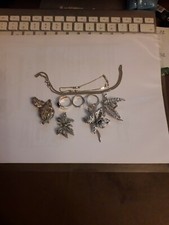 lotto braccialetto bambina unoaerre argento +catenella,3 anelli ,due spille arge