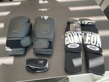 KIT BOXE LEONE1947  NERO: GUANTONI 10OZ, Bendaggi2.5m(AB705, Paratibia XS(PT133)