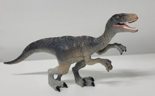 Figurina dinosauro in gomma Canna Velociraptor 2020 nuova 