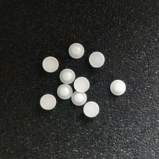 Bottoni linguali in ceramica