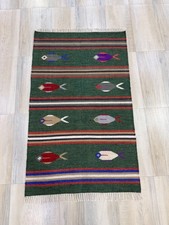 Tappeto in lana intrecciata a