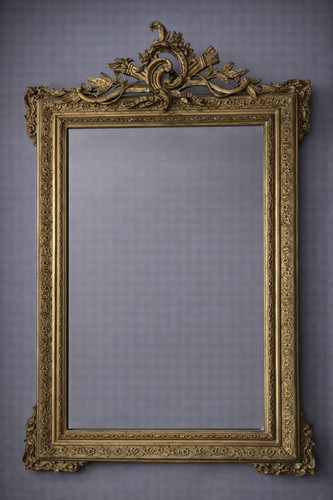 Antico specchio dorato con