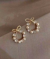 Orecchini con fiocco di perle