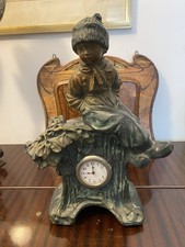 Scultura bimbo con orologio - con,
