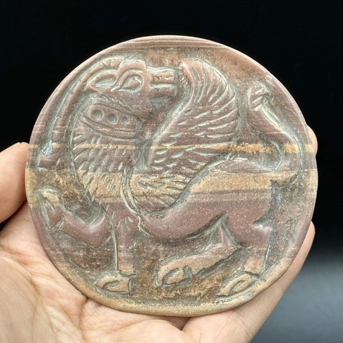 Antica piastra rotonda grifone