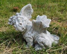 Statua in pietra drago