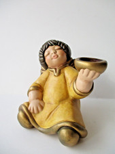 Thun angelo seduto senza