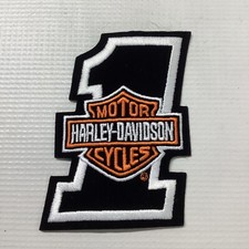 Harley Davidson #1 toppa barra e scudo 4,25”x 2 7/8” numero uno nuova nera/wht/org