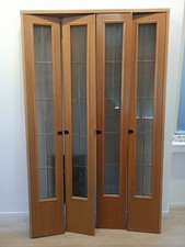 Porta pieghevole a libro 4 ante in Rovere e Vetro molatocomprese mostrineLarga