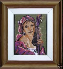 quadro punto croce ragazza con chitarra cornice dorata