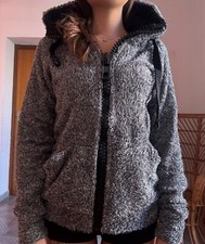 Felpa grigia-nera con cerniera