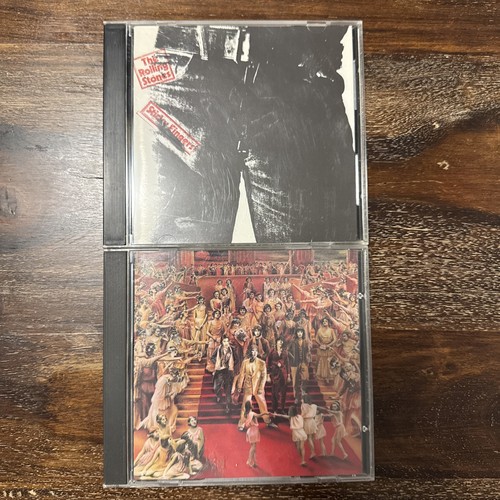 Two cds rolling stones - by,