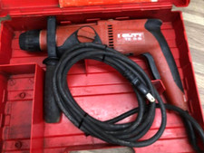 Trapano a percussione rotativo