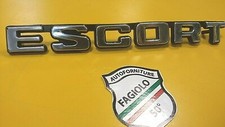 SCRITTA "ESCORT" LOGO FORD FREGIO PLASTICA NERA BADGE STEMMA CROMATO FORD ESCORT