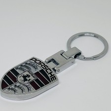 Portachiavi in acciaio con stemma Porsche – NUOVO – 9×3 cm – finitura argento
