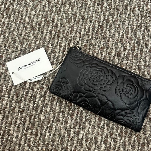 Black floral zip wallet purse.