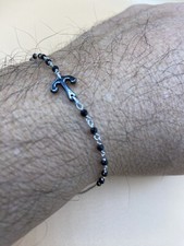 Bracciale uomo oro 18 kt, onice e titanio