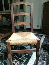 ECCEZIONALE LOTTO DI 20 SEDIE IN STILE ARTE POVERA IN LEGNO DI NOCE E PAGLIA.