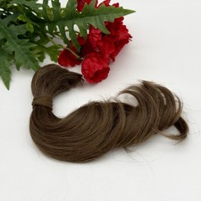 Bambola rinata taglio capelli