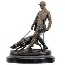 Scultura cacciatore cane in