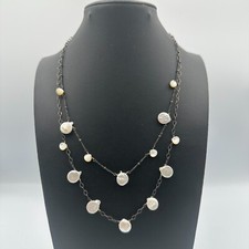 Collana di perle con moneta