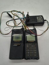 Coppia motorola 8700 parzialmente danneggiati con un caricabatterie