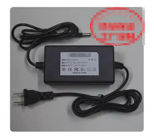 Caricabatteria adattatore per