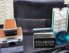 Macchina fotografica terrestre Polaroid SX-70 vintage anni 70 e custodia con pellicola e flash ed extra