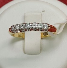 Anello Riviera in Oro Giallo e Bianco 18kt con 7 Diamanti taglio Brillante.