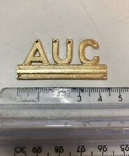 Distintivo Dorato, Sigla AUC. Seconda Guerra Mondiale. Divisa Militare