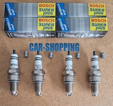 KIT 4 CANDELE BOSCH AUDI 80 100 A6 VW GOLF LUPO PASSAT POLO VENTO 1.41.61.82.0