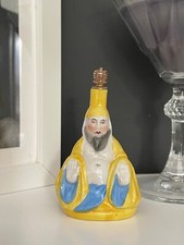 Antique Crown Top Porcelain Figural Seated Monk Shaped Scent Perfume Bottle