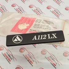 EMBLEMA SIGLA MODELLO AUTOBIANCHI A112 LX COD. 5756930 NUOVO ORIGINALE