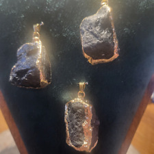 Ciondolo in acciaio dorato con