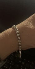 Bracciale tennis con crocetta oro bianco 18k e diamanti naturali da donna