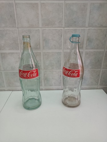 Due bottiglie coca cola in - coca-cola,