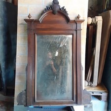 Specchio con cornice in legno  lavorata 