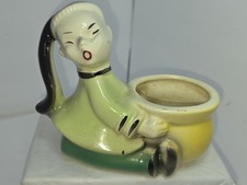 Statuina fioriera ceramica