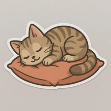 Gattino che dorme su cuscino