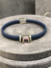 bracciale caucciù e argento925% Con pietra rosa e zirconi
