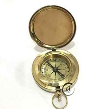 Bussola con pulsante in ottone