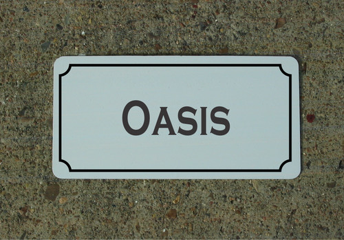 Insegna metallo oasis - in,