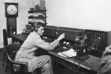 Man operating telephone