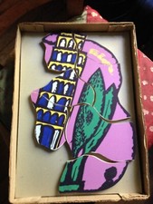 Ugo Nespolo, puzzle Torre di Pisa con libro di Enrico Crispolti