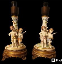 Coppia di lampade in ceramica con angioletti firmate carpiè capodimonte