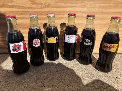 Various full coca - cola, bottle